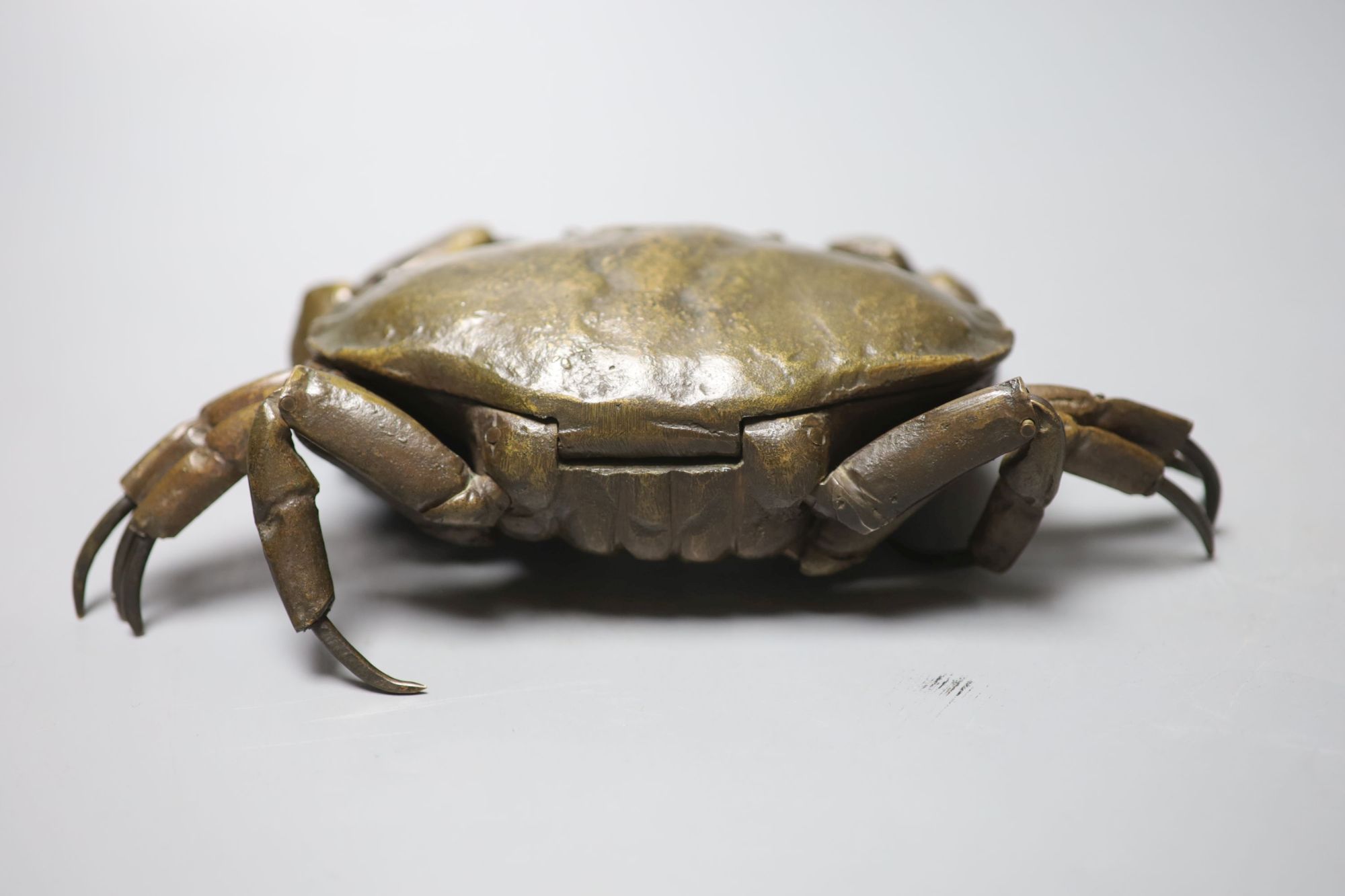 A mid 20th century bronze articulated model of a crab, with hinged carapace, 26cm across